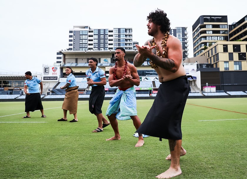 Braden Hamlin-Uele and Ronaldo Mulitalo take part in a Samoan cultural dance at the Sharks' season launch.