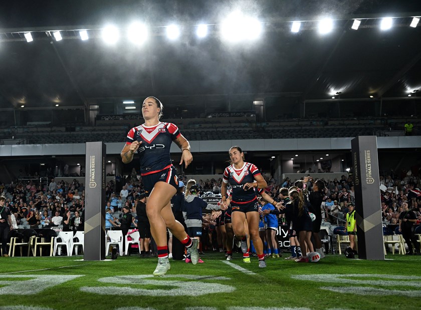 Isabelle Kelly leads out the Roosters.