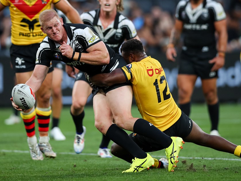 Griffin Neame offloads while playing for the Kiwis last year.