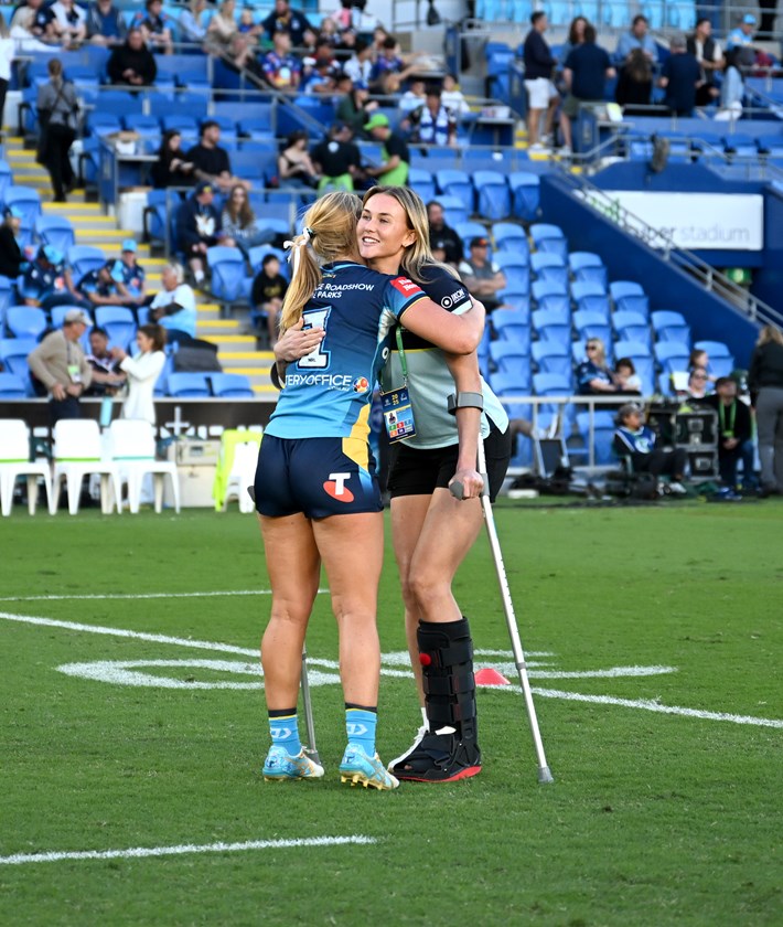 Lailani Montgomery and Jaime Chapman embrace.