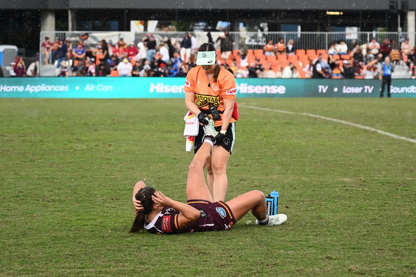 Jada Ferguson receives medical assistance during the Broncos v Roosters game.