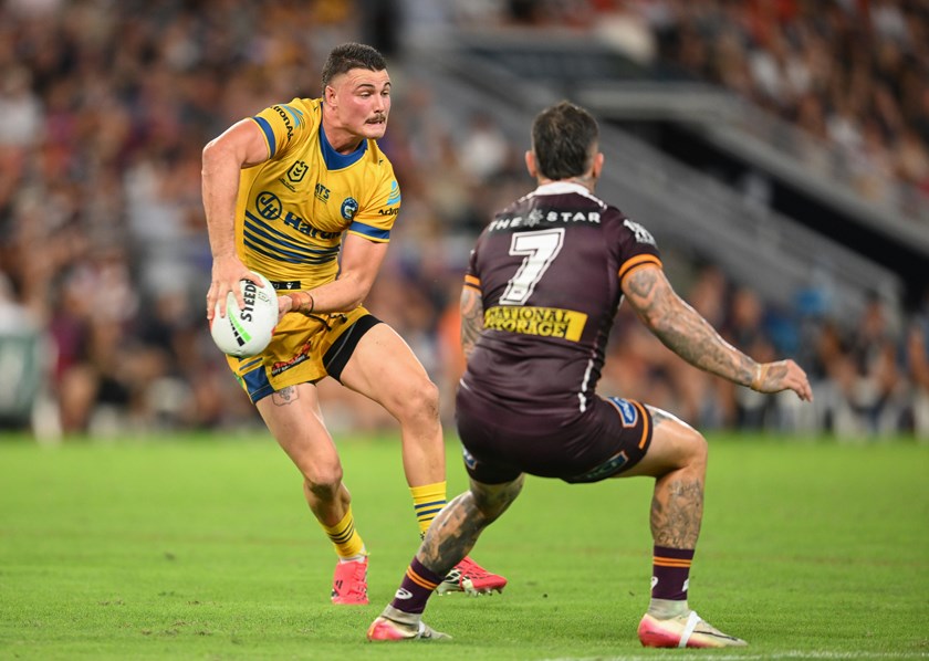 Jonah Pezet with the ball faces off against Broncos halfback Adam Reynolds.