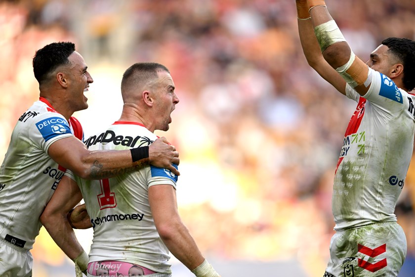 Clint Gutherson celebrates with Valentine Holmes and Tyrell Sloan, who also picked up two tries.
