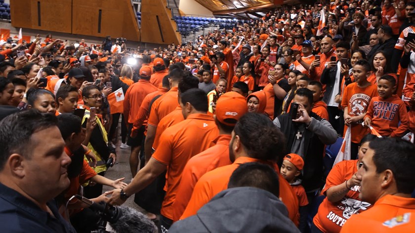 Tonga players are greeted by fans in Auckland.