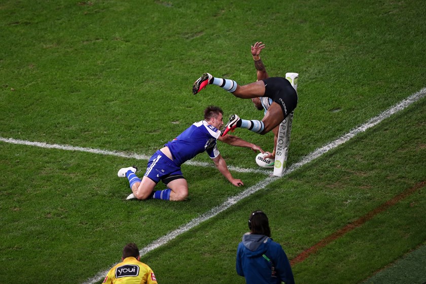 Sharks winger Sione Katoa scores a try.