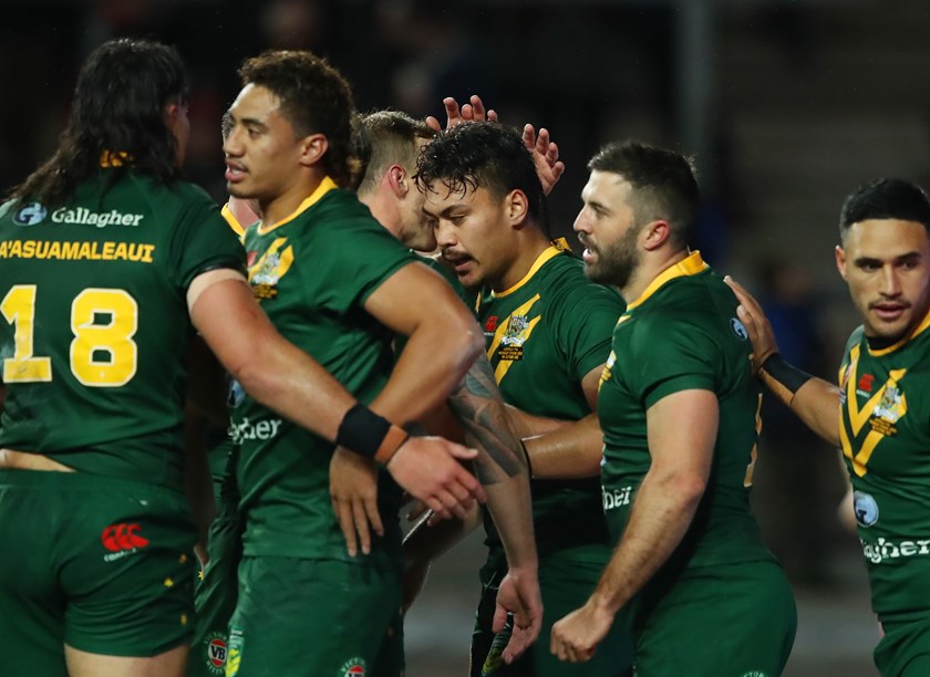 Jeremiah Nanai celebrates a try on his Test debut for Australia.
