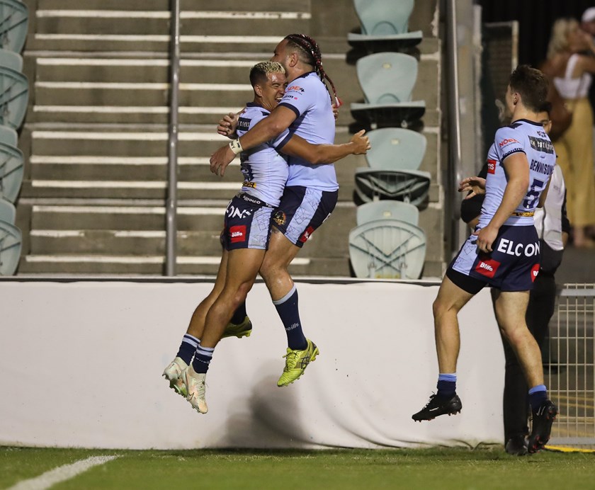 Konrad Hurrell and Tee Ritson celebrates the latter's try against the Dragons