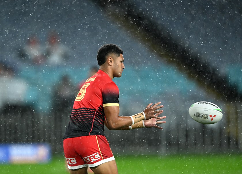 Wet conditions at Accor Stadium as the team warm up.