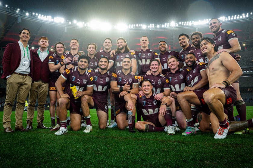 Queensland players celebrate their 26-24 win with a team photo at Optus Stadium after Origin II. 