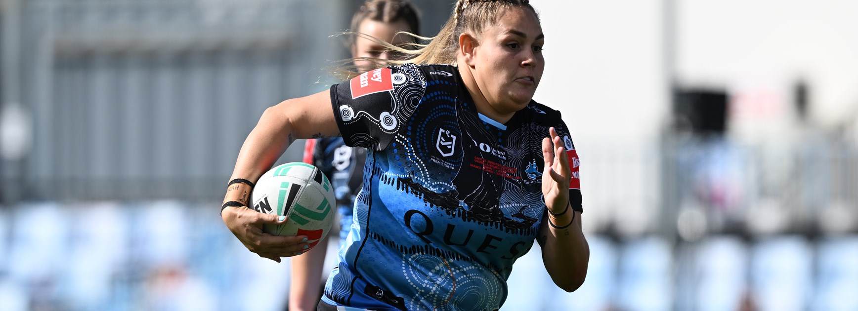 Caitlan Johnston-Green made her NRLW debut for the Sharks against the Titans.