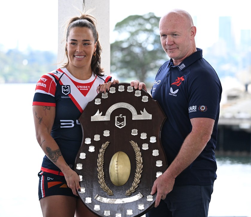 Roosters captain Isabelle Kelly and coach John Strange with the Nellie Doherty Shield for winning the 2025 NRLW minor premiership.