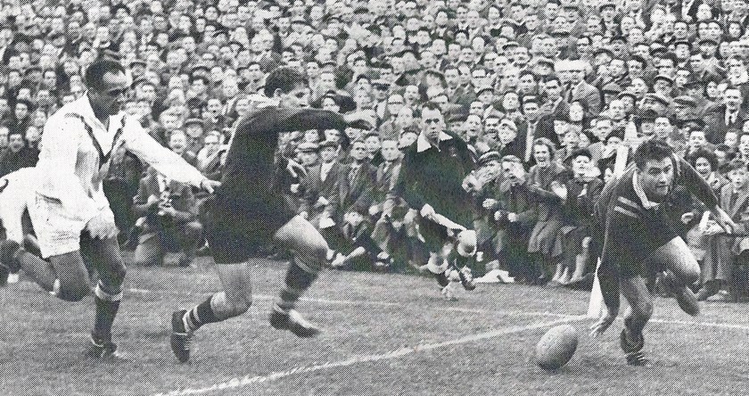 Reg Gasnier crossing for one of the three tries he posted in the First Test of the 1959 series, his Ashes debut.